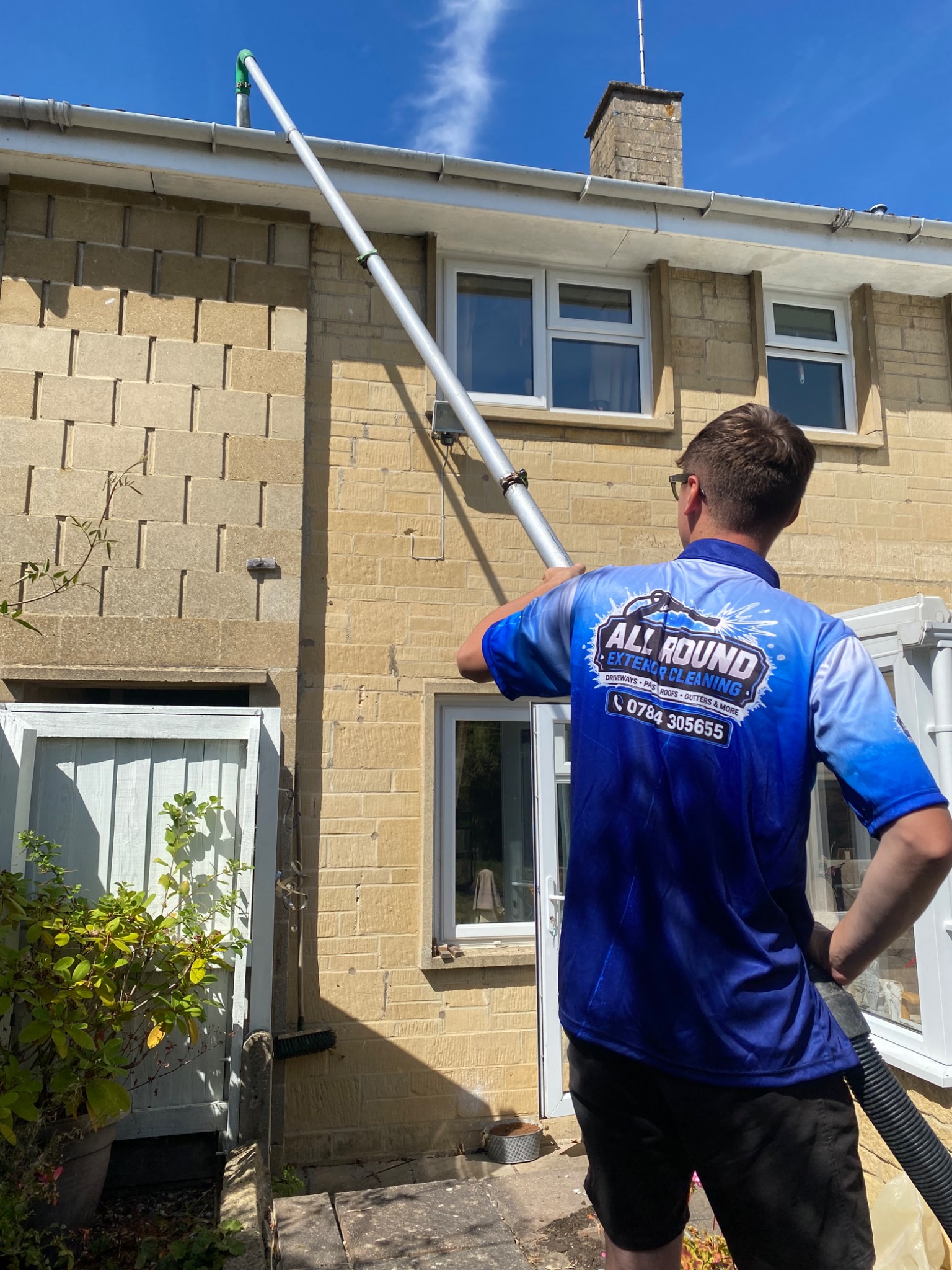 Professional gutter clearance in progress