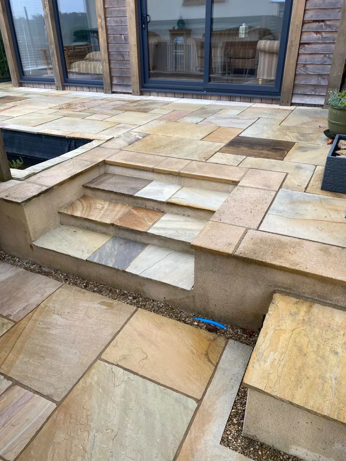 Clean sandstone patio and garden steps