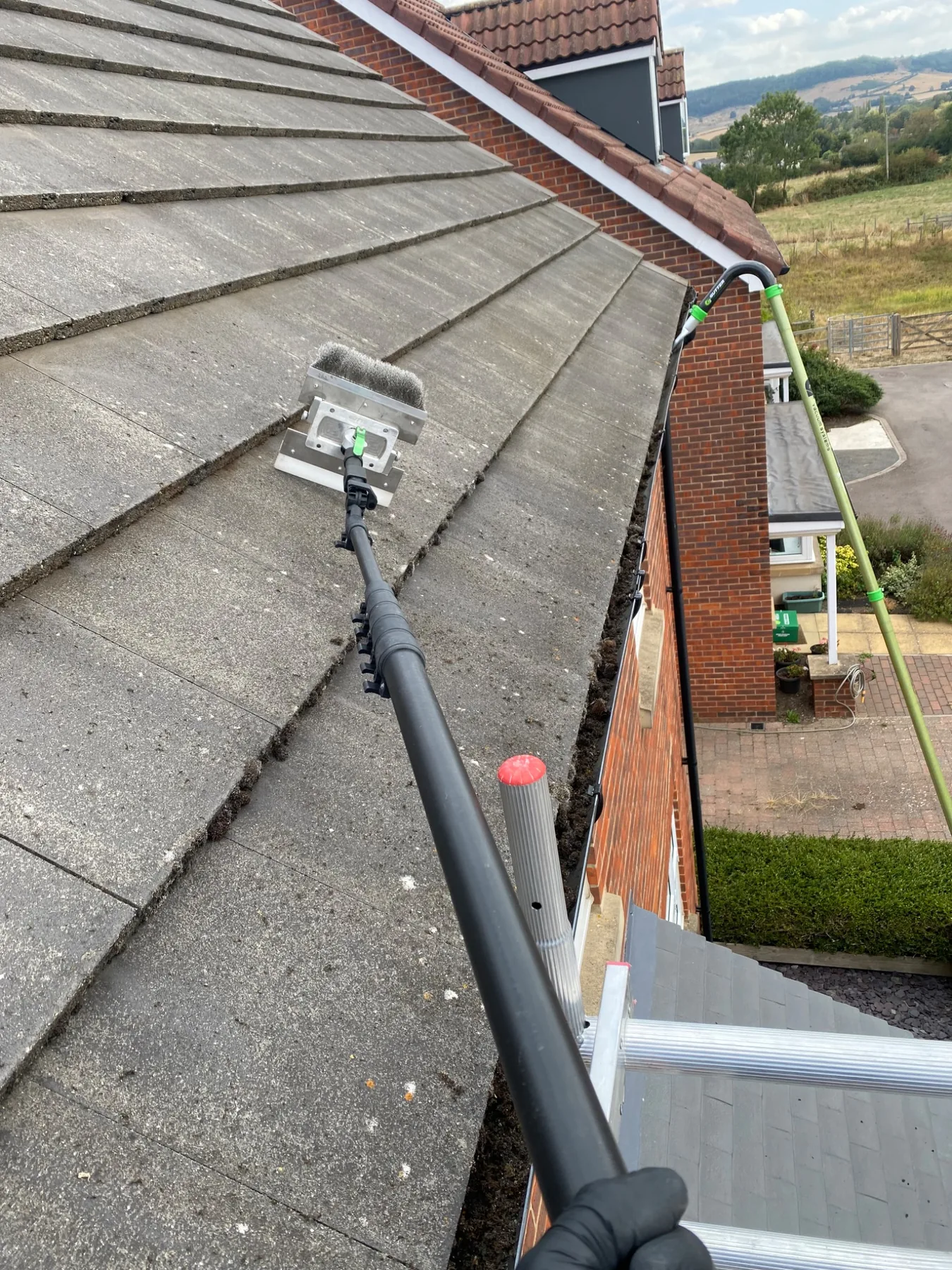 Professional roof cleaning and gutter clearance work